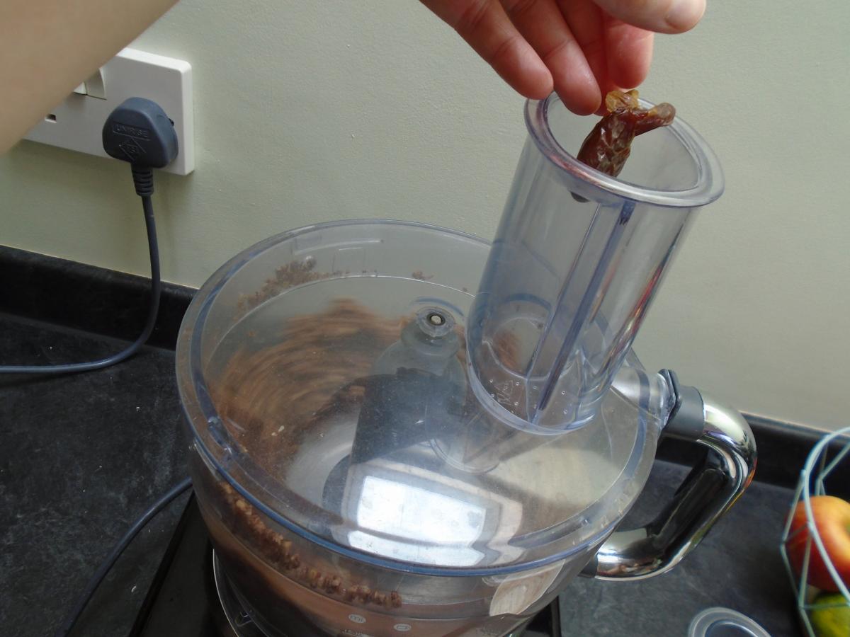 Add 80g stoned dates one by one to the food processor while it's still on