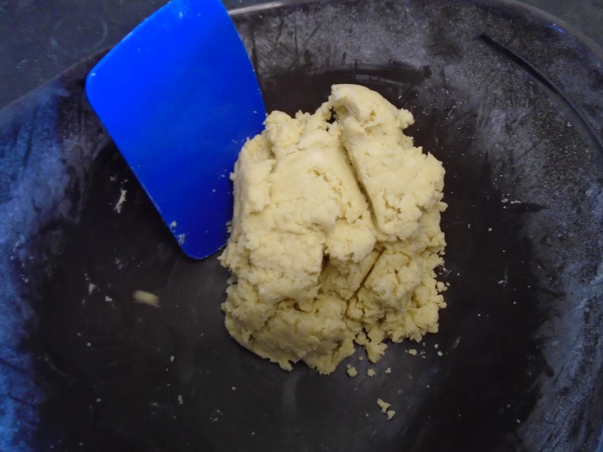 Once the dough has roughly come together, use your hands to shape it into a ball