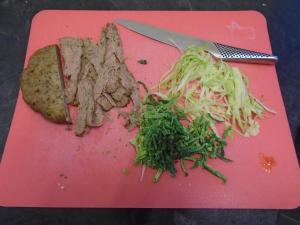 Slice and chop your salad ingredients – I like finely shredded savoy cabbage and lettuce