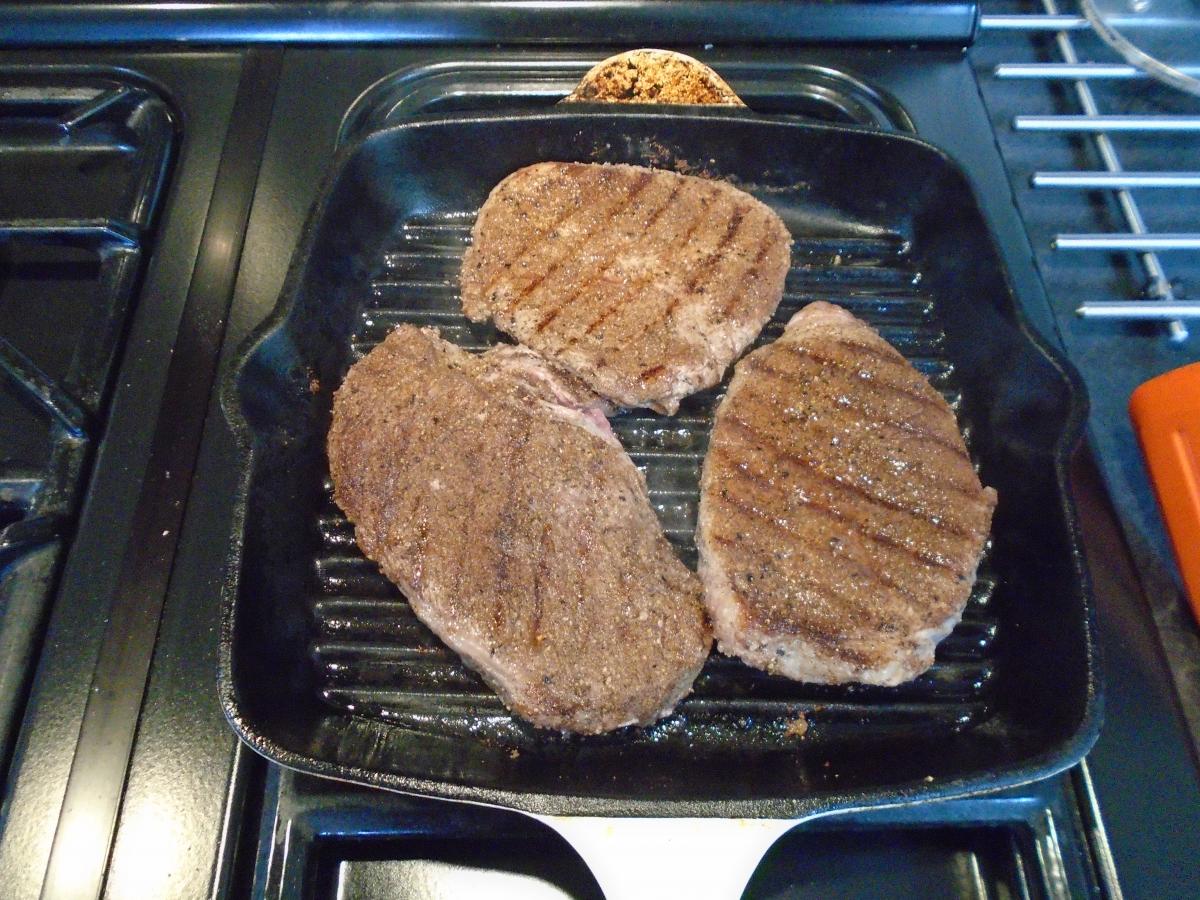 Fry or griddle the seasoned steaks in ½ tablespoon of coconut oil, flipping every minute until cooked to your liking