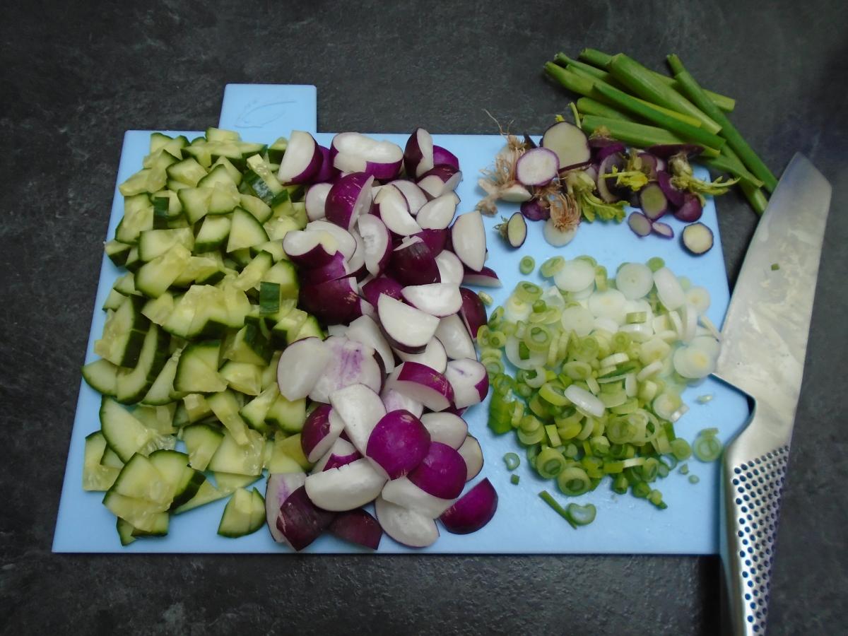 Dice up ½ a cucumber, quarter 200g radishes and finely slice 4 spring onions