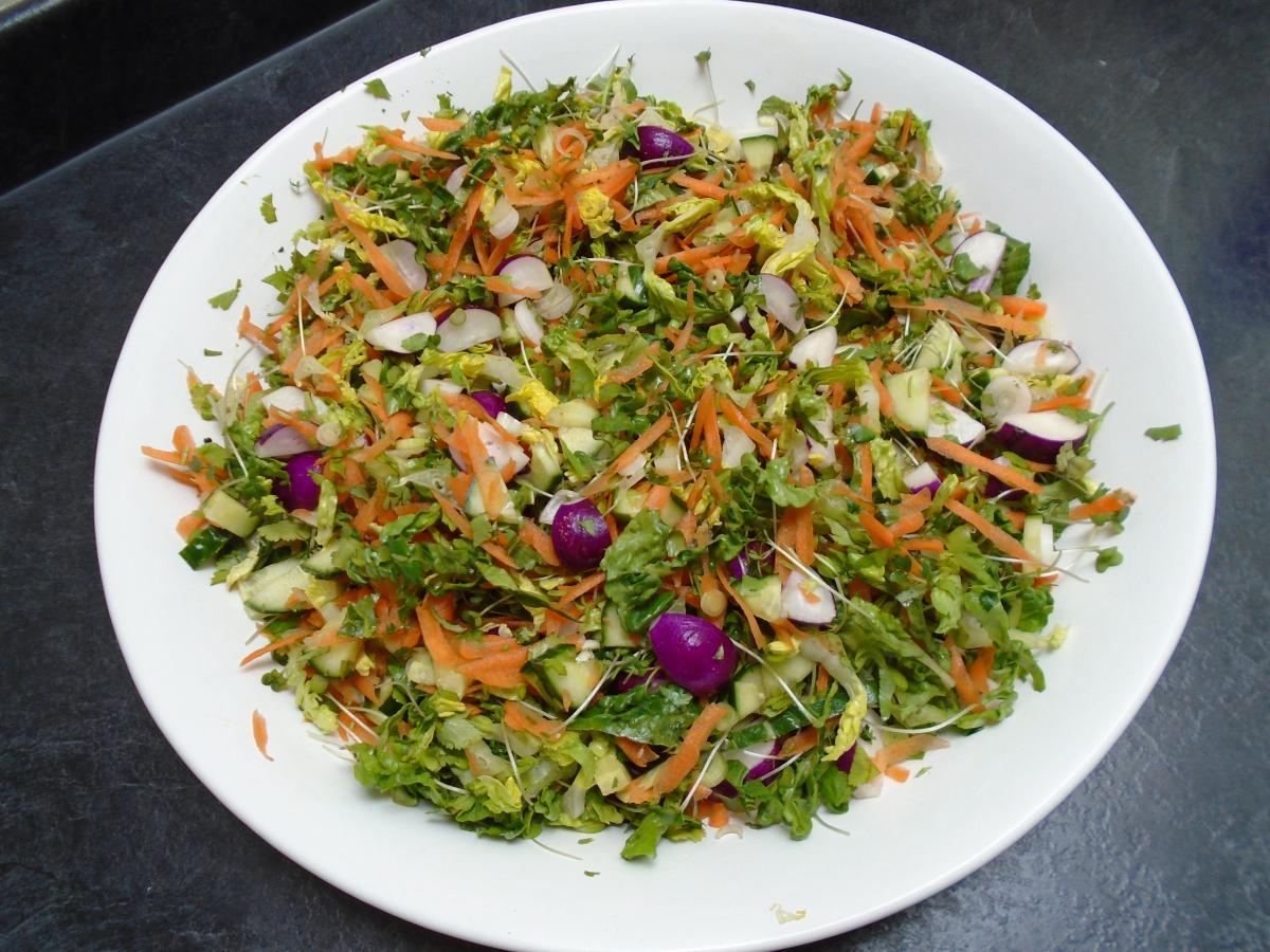 Mix the cucumber, radishes & spring onions together with 3 grated carrots, 1 shredded little gem lettuce & a small bunch of roughly chopped coriander before snipping 1 punnet of cress over the top