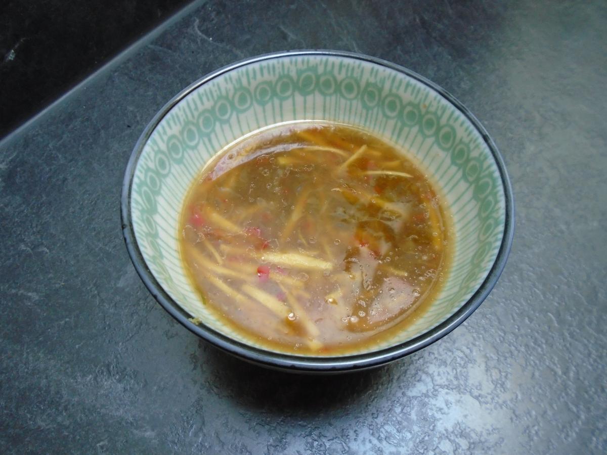 To make the dressing, very thinly slice a thumb-sized piece of ginger, finely chop 1 chilli, and mix both with 2 tbsp each of fish sauce & soy sauce, 1 tbsp sesame oil and the juice of 3 limes