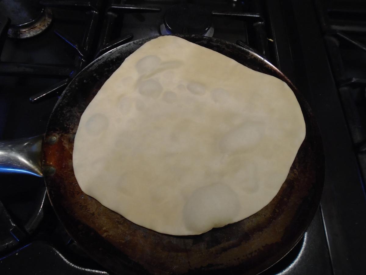 Heat a frying pan on high and cook the flatbreads for about 30 seconds per side