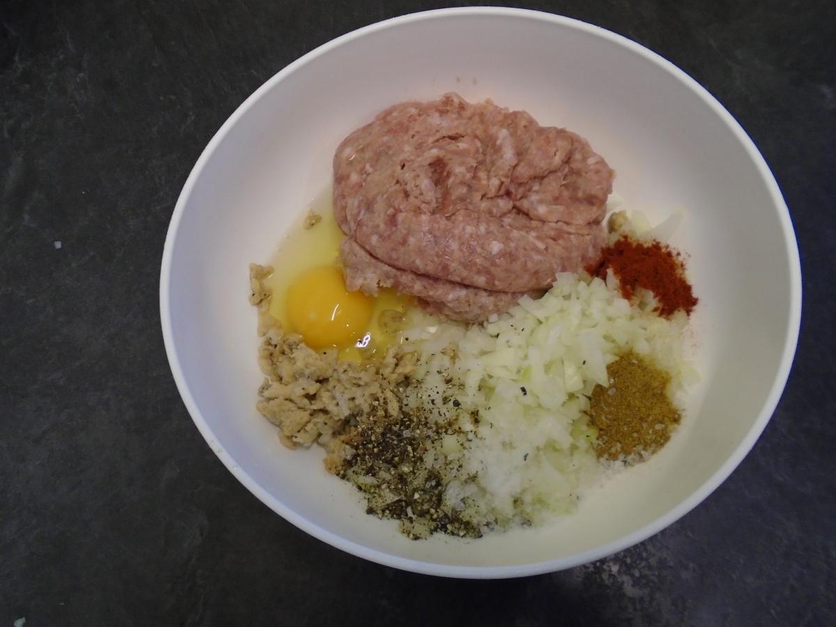 Add 250g sausage meat, 1 medium onion, 1 egg, the milky bread, ½ tsp ground cumin, ½ tsp paprika & s&p to a bowl